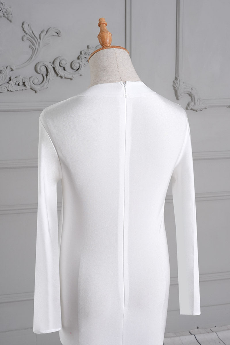 Detail shot of the back of a white long sleeve silk maternity dress