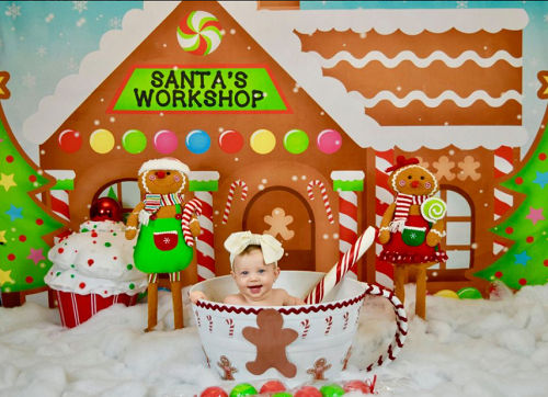 Kate Weihnachten schneebedeckte Lebkuchenstadt Kinder Hintergrund von Leann West